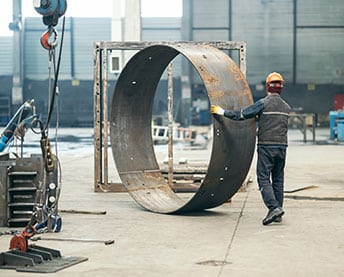 person rolling a steel wheel