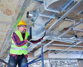 person working with vents